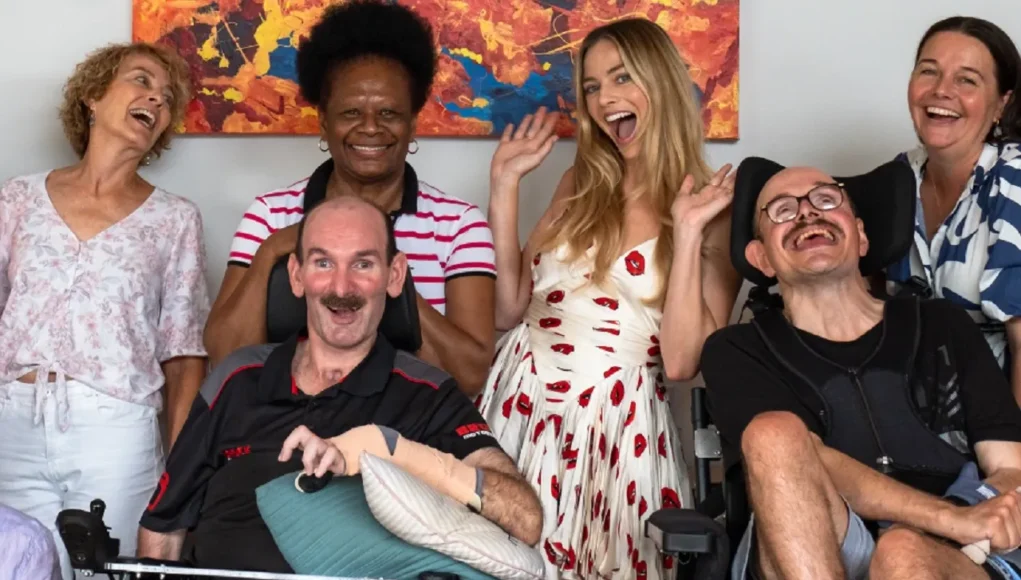 margot robbie, young care australia, donation, high care disabilities, charity australia, surprise visit, aacta award australia, brisbane, high care disability support australia, australian actress supports disability charity, margot robbie makes a difference