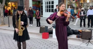 Careless Whisper, Street performance violinist, Teenage violinist talent, Saxophone and violin duet, George Michael cover song, Musical collaboration on streets, Heartwarming musical performance, Ukrainian violinist sensation, Saxophone tunes with violin, Viral street musicians, 80s classic reinvention