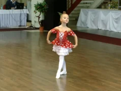 Chipollino Ballet Performance, Six-Year-Old Ballet Dancer, Anastasia Ballet Video, Children's Ballet Performance, Vibrant Ballet Costumes, Young Ballet Stars, Heartwarming Ballet Performances, Red and White Polka Dot Dress Ballet, Captivating Dance Videos, Playful Ballet Characters