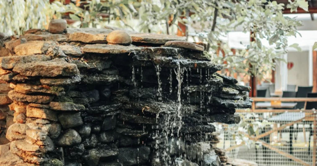 DIY waterfall, backyard design, water feature, outdoor living, pondless waterfall, landscaping, garden project, Aquascape, DIY project, waterfall kit

