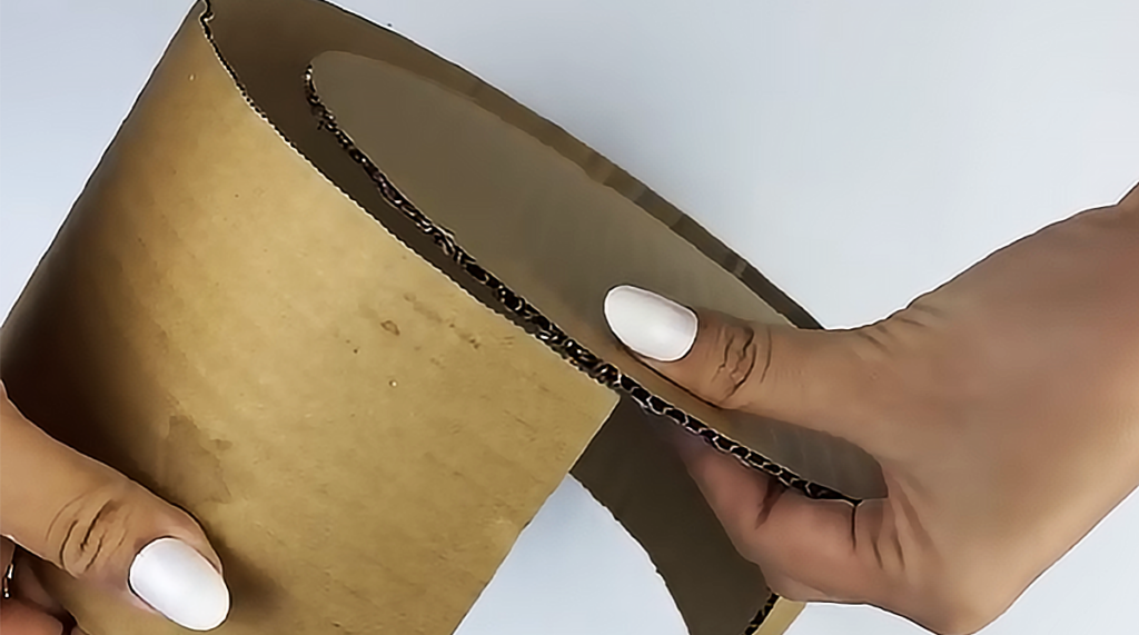 A handmade DIY storage basket made from paper straws and cardboard, styled as a cute recycled organizer for home decor, desk storage, or small household items.