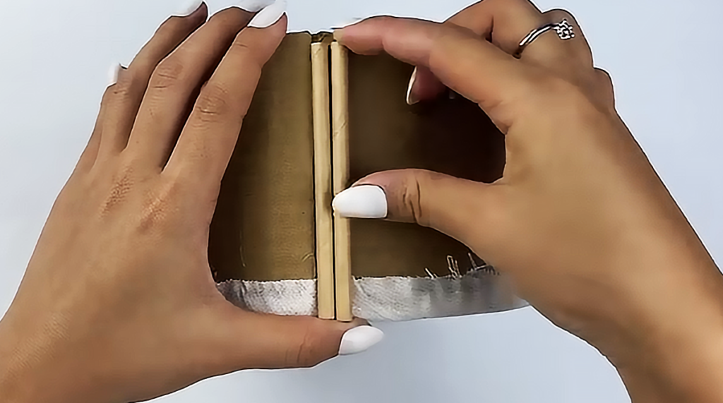 A handmade DIY storage basket made from paper straws and cardboard, styled as a cute recycled organizer for home decor, desk storage, or small household items.