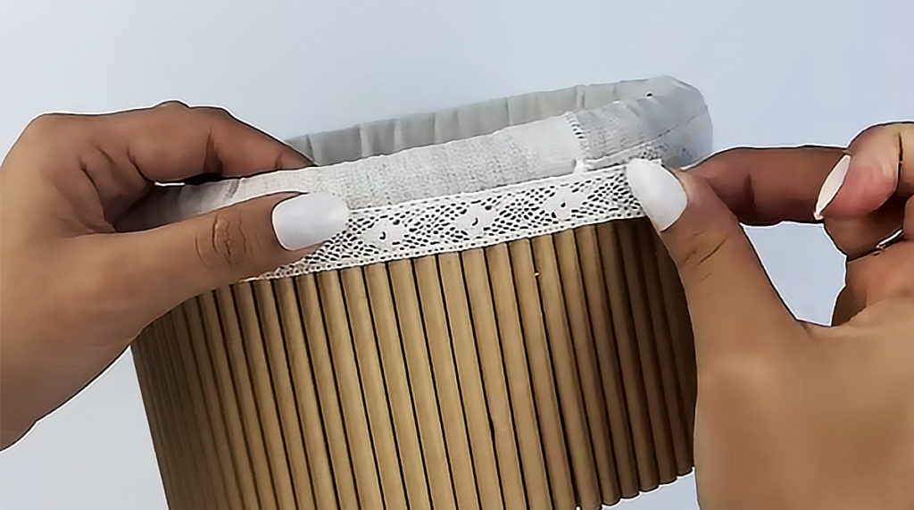 A handmade DIY storage basket made from paper straws and cardboard, styled as a cute recycled organizer for home decor, desk storage, or small household items.